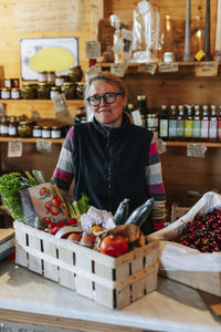 Smiling shop assistant in eco shop