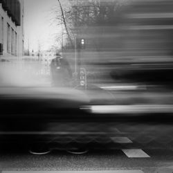 Blurred motion of car on road