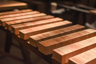 Close-up of piano keys on wooden table