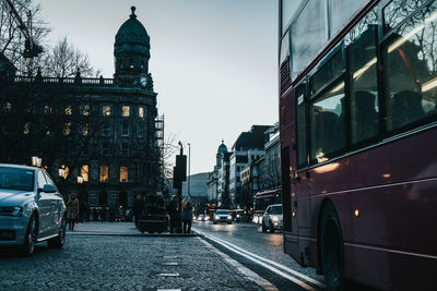 Street amidst buildings in city against sky