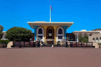 Built structure by building against clear blue sky