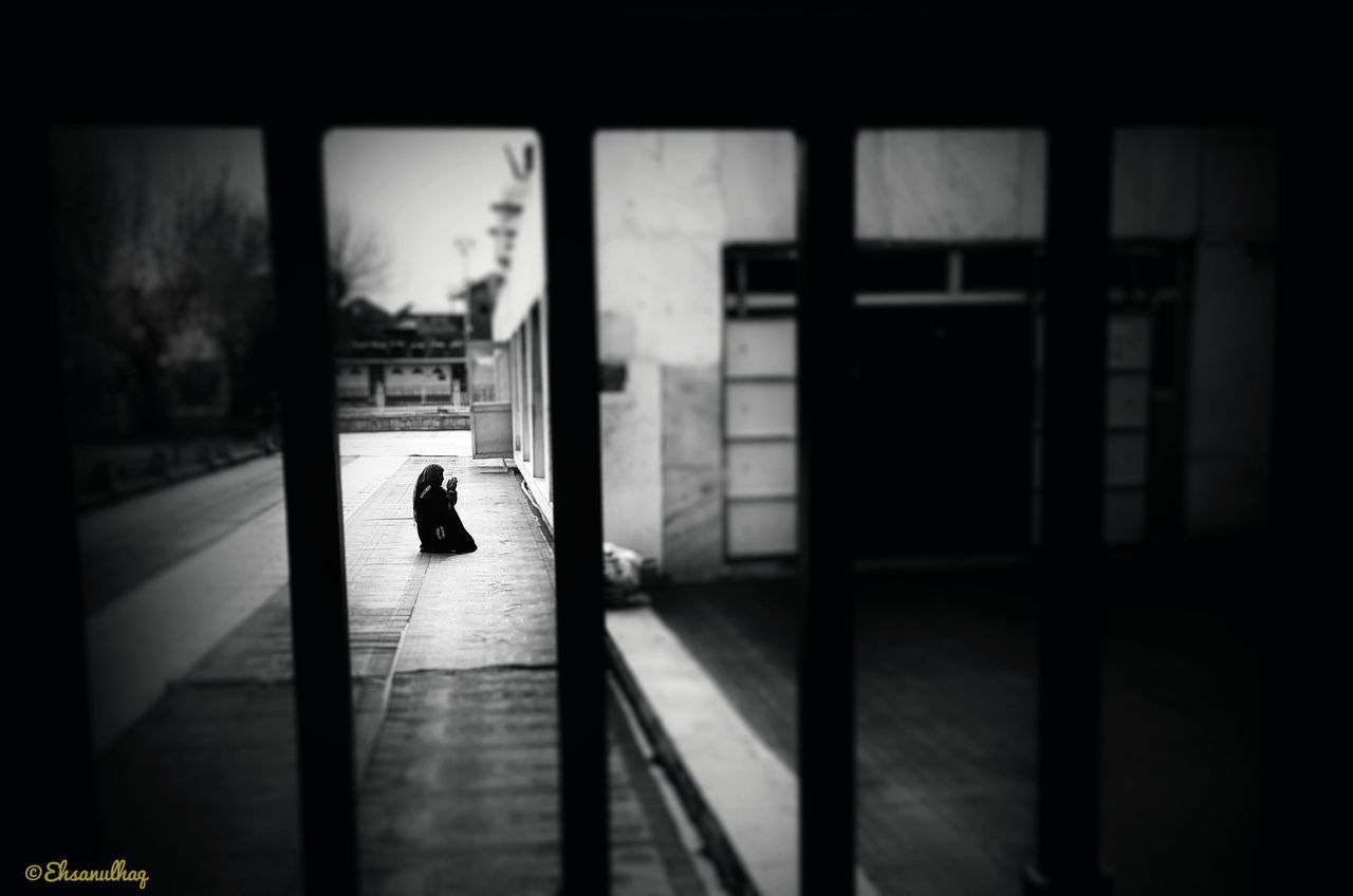 SILHOUETTE OF PERSON WALKING IN BUILDING