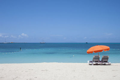 Chairs on sunny beach