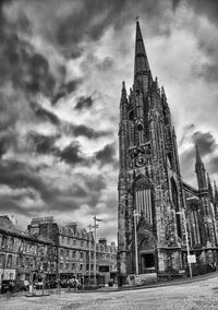Building exterior against cloudy sky