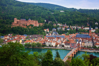 View of townscape by river in town