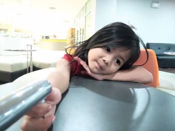 Portrait of cute girl on table