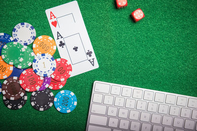 High angle view of cards and gambling chips on table