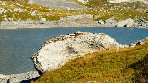 Scenic view of rocks by sea