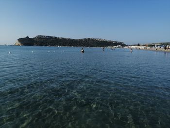 Scenic view of sea against clear blue sky