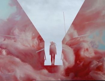 Rear view of man and woman against sky