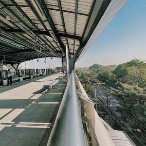 Road by city against sky