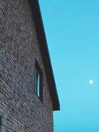 Low angle view of building against blue sky