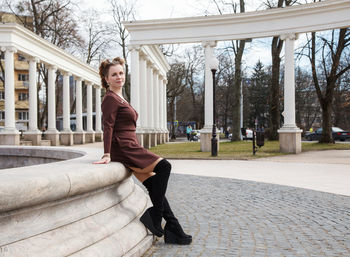 Portrait of woman sitting outdoors