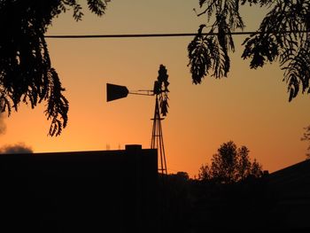 Low angle view of silhouette trees against sky during sunset