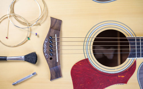 High angle view of guitar on table