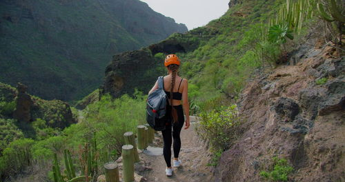 Woman tourist in a hemlet hiking in gorge and mountains. barranco del infierno. tenerife. 