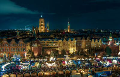 Illuminated buildings in city at night