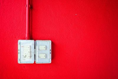 Close-up of telephone mounted on wall