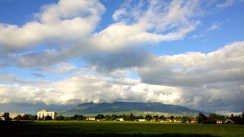 Scenic view of landscape against cloudy sky