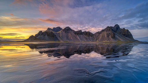 Dramatic evening sunset sky over vestrahorn mountain in stokksnes, iceland