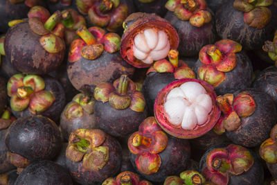 High angle view of mangosteens for sale at market stall