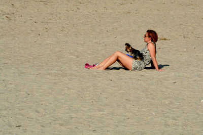 Woman lying on beach