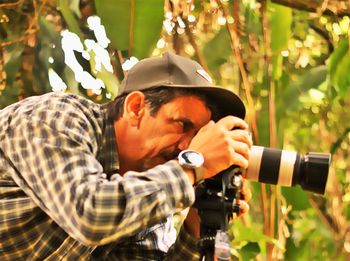 Woman photographing through camera