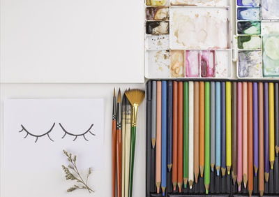 Close-up of multi colored pencils on table