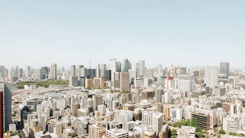 High angle view of modern buildings against clear sky