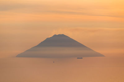 Scenic view of desert against sky during sunset