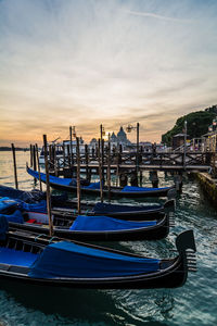 Boats moored at harbor