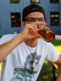 Portrait of young men drinking drink