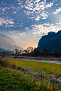 Scenic view of field against sky during sunset