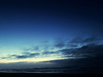 Scenic view of sea against sky at sunset