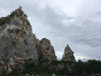 Low angle view of rock formation against sky