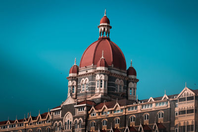 Low angle view of building against blue sky