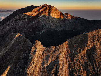 Scenic view of mountains against sky during sunset