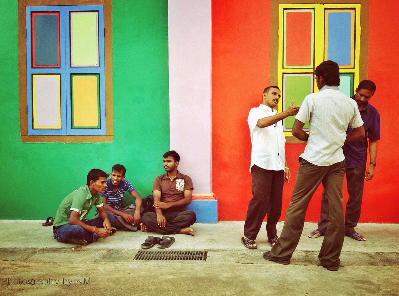 lifestyles, togetherness, leisure activity, full length, men, casual clothing, bonding, building exterior, sitting, architecture, boys, built structure, love, friendship, childhood, person, family