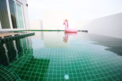 People relaxing in swimming pool