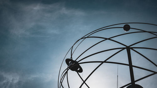 Low angle view of silhouette street light against sky