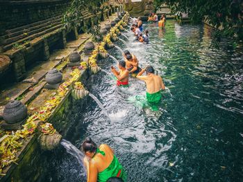 High angle view of people enjoying in water