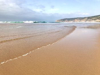 Scenic view of beach against sky