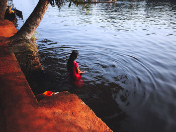 High angle view of swan swimming in lake