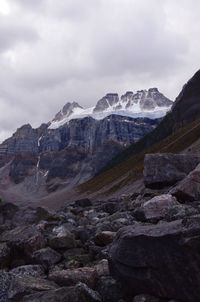 Scenic view of mountains against cloudy sky