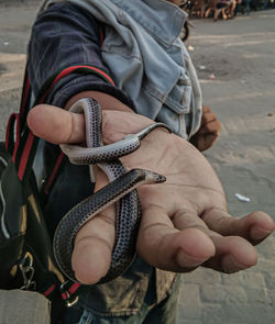 Close-up of man holding hands