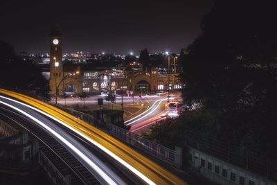 High angle view of light trails on road at night