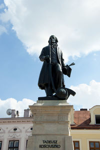 Low angle view of statue against sky