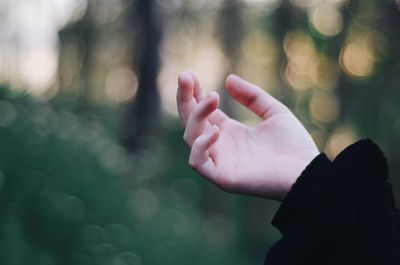 Cropped hand of person gesturing outdoors