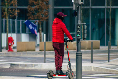 Man riding bicycle on road