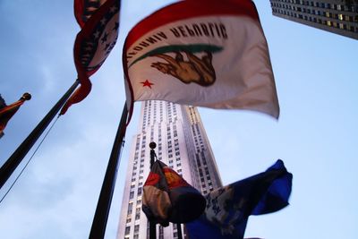 Low angle view of flag against sky